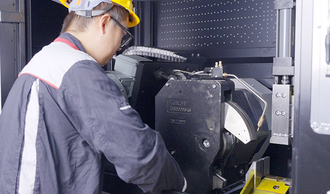 JLH technician performing machine maintenance